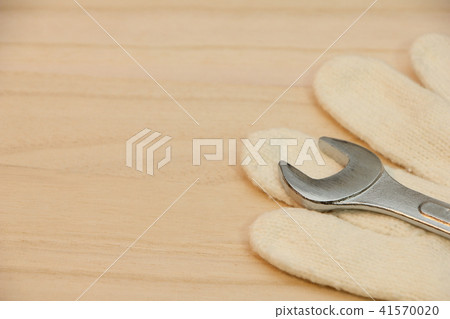 Warrior and spanner placed on wooden board Warrior and spanner placed on wooden board 41570020