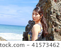 Woman posing on the beach in summer 41573462