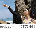 Woman posing on the beach in summer 41573463