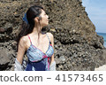 Woman posing on the beach in summer 41573465
