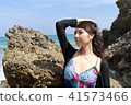 Woman posing on the beach in summer 41573466