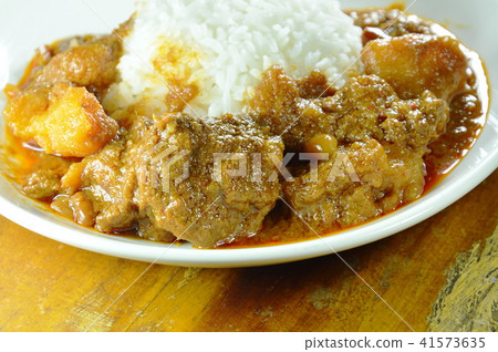 pork curry and potato with rice on plate pork curry and potato with rice on plate 41573635