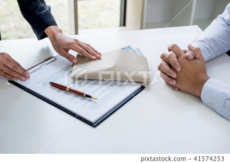 Bribery and corruption concept, bribe in the form of dollar bill Bribery and corruption concept, bribe in the form of dollar bill 41574253
