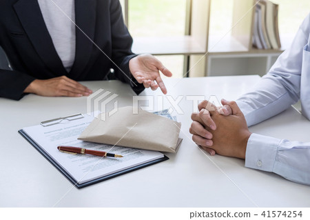 Bribery and corruption concept, bribe in the form of dollar bill Bribery and corruption concept, bribe in the form of dollar bill 41574254