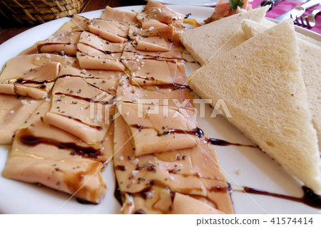 slice raw foie gras with sea salt slice raw foie gras with sea salt 41574414