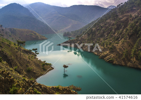 Green lake in mountains Green lake in mountains 41574616