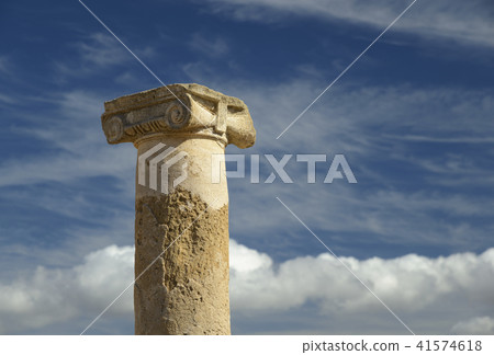 Ionic column against beatiful blue sky background Ionic column against beatiful blue sky background 41574618
