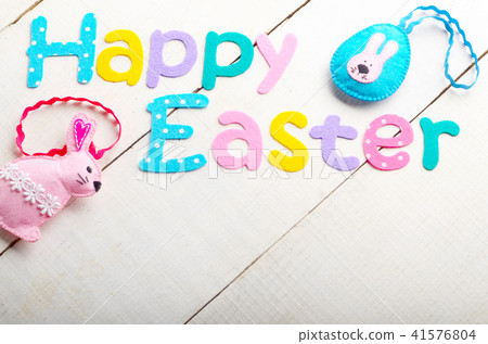 Happy Easter phrase made of fabric letters Happy Easter phrase made of fabric letters 41576804
