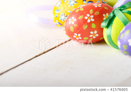 Painted decorated easter eggs on white table Painted decorated easter eggs on white table 41576805