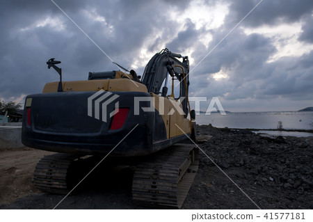 Backhoe loader was digging in the ground Backhoe loader was digging in the ground 41577181