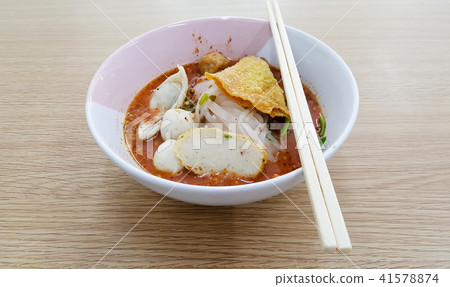Noodle bowl placed on a wooden table. Noodle bowl placed on a wooden table. 41578874