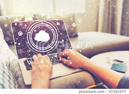Cloud computing with person using laptop computer 41582975