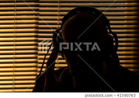 FBI secret agent listens and records the conversat 41590763