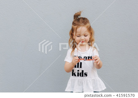 beautiful little girl having fun in the city. we are all kids 41591570