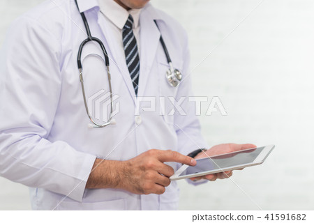 doctor using digital tablet on white background doctor using digital tablet on white background 41591682