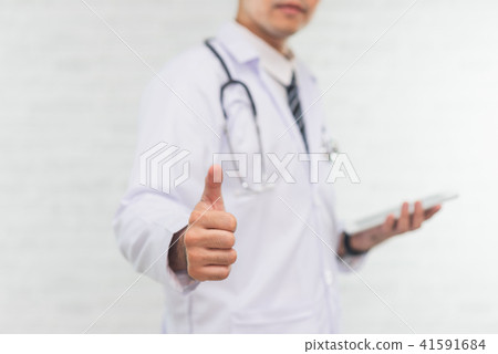 doctor using digital tablet on white background doctor using digital tablet on white background 41591684