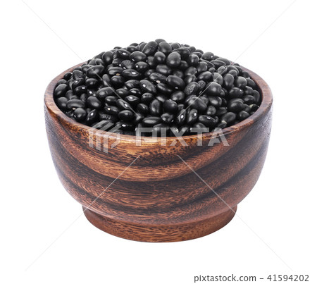 Black beans in wooden bowl isolated on white background Black beans in wooden bowl isolated on white background 41594202