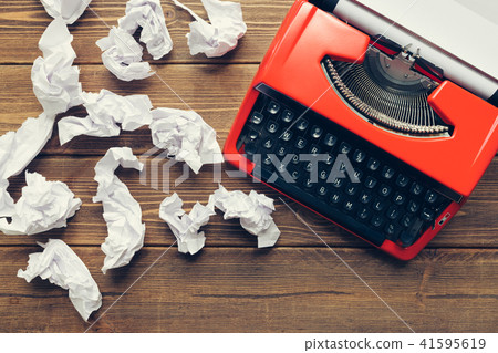 Vintage typewriter on wooden background Vintage typewriter on wooden background 41595619
