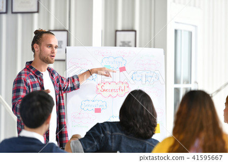 Young businessman giving presentation  41595667
