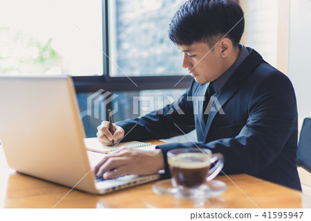 Young Asian businessman working in office 41595947