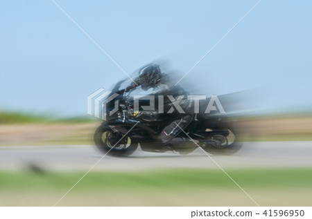 motion blur of the of a motorcycle racing running motion blur of the of a motorcycle racing running 41596950