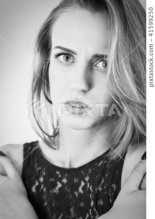 scared beautiful girl 41599250