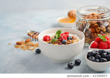 Homemade granola with yogurt and fresh berries. Homemade granola with yogurt and fresh berries. 41599957