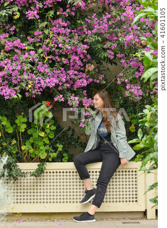 Teen girl and bougainvillea flowers in garden Teen girl and bougainvillea flowers in garden 41601105