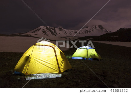 Tents of tourists are located at the foot of Mount 41601332