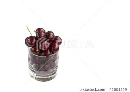 Red cherry in a transparent glass isolated Red cherry in a transparent glass isolated 41601339