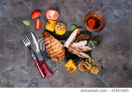 Fresh three types of grilled steak (chicken, pork, beef) on slate plate with herbs, tomato and Fresh three types of grilled steak (chicken, pork, beef) on slate plate with herbs, tomato and 41601665