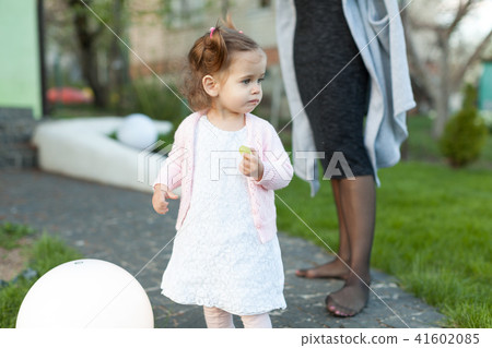 little girl child playing on the lawn little girl child playing on the lawn 41602085