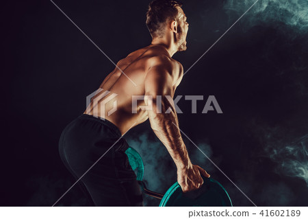 muscular bodybuilder handsome men doing exercise muscular bodybuilder handsome men doing exercise 41602189