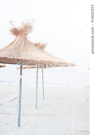 empty old beaches sunbeds umbrellas sand 41602855