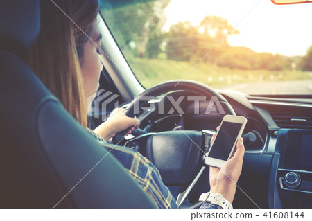Woman traveler Using Smart Phone Car Inside 41608144