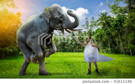 Freak man wrapped in film plays with elephant 41611146