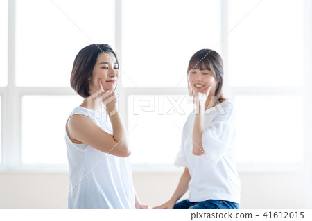Two women interested in beauty Two women interested in beauty 41612015