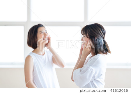 Two women interested in beauty Two women interested in beauty 41612016