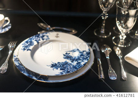 Glasses, forks, knives, napkins on dark black table 41612781
