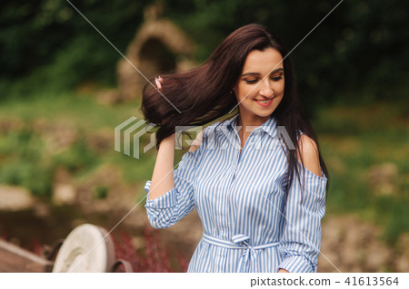 Beautiful girl spend time near the lake 41613564