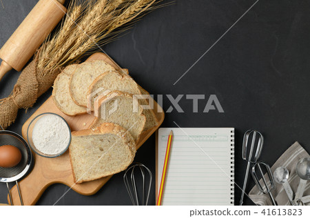 Sliced Whole wheat bread with blank notebook 41613823