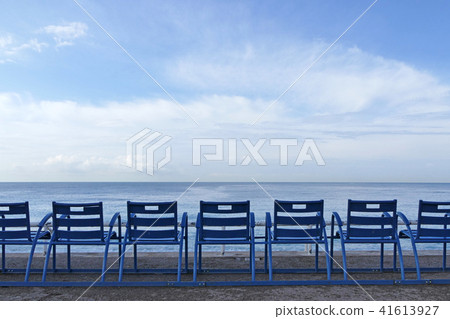 Blue chairs on the beach of Nice, France Blue chairs on the beach of Nice, France 41613927