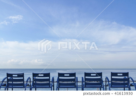 Blue chairs on the beach of Nice, France 41613930