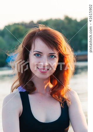 Portrait of pretty girl smiling, in summer nature Portrait of pretty girl smiling, in summer nature 41615902