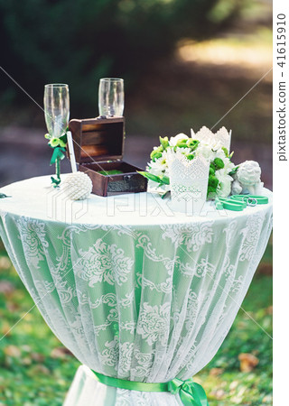 green wedding decorations. table decorated with a green cloth 41615910