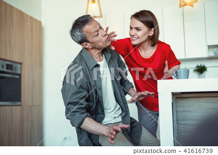 Insane dark-haired woman beating her husband 41616739