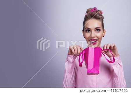 Woman with small shopping bag Woman with small shopping bag 41617461