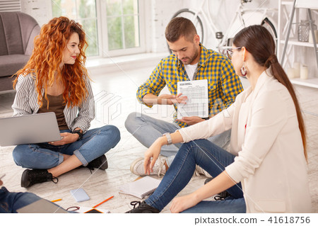 Enthusiastic three students having discussion 41618756