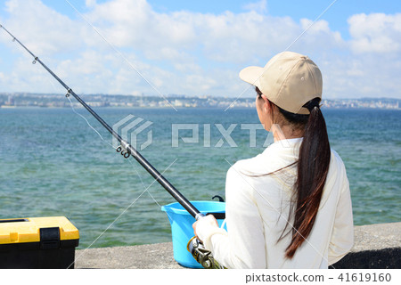 A woman enjoying fishing A woman enjoying fishing 41619160