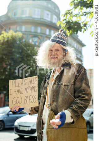 Homeless wearing old brown leather jacket Homeless wearing old brown leather jacket 41619981